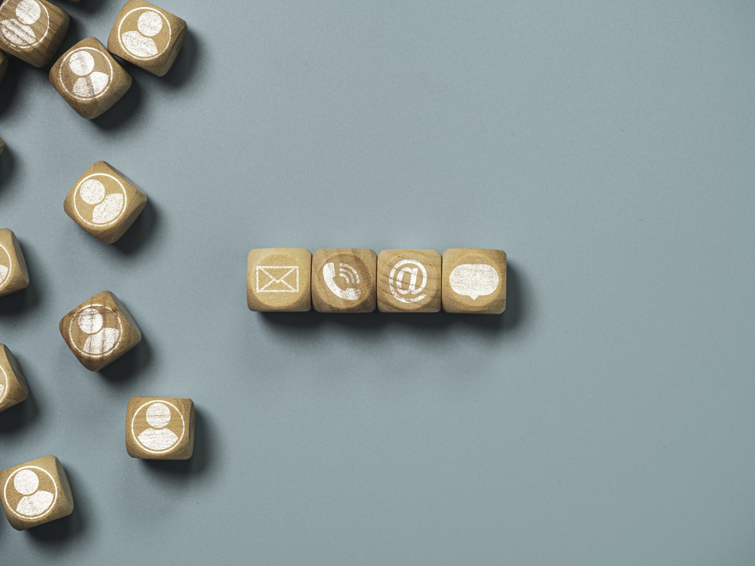 customer service business contact concept wooden cube block which print screen letter telephone email address message